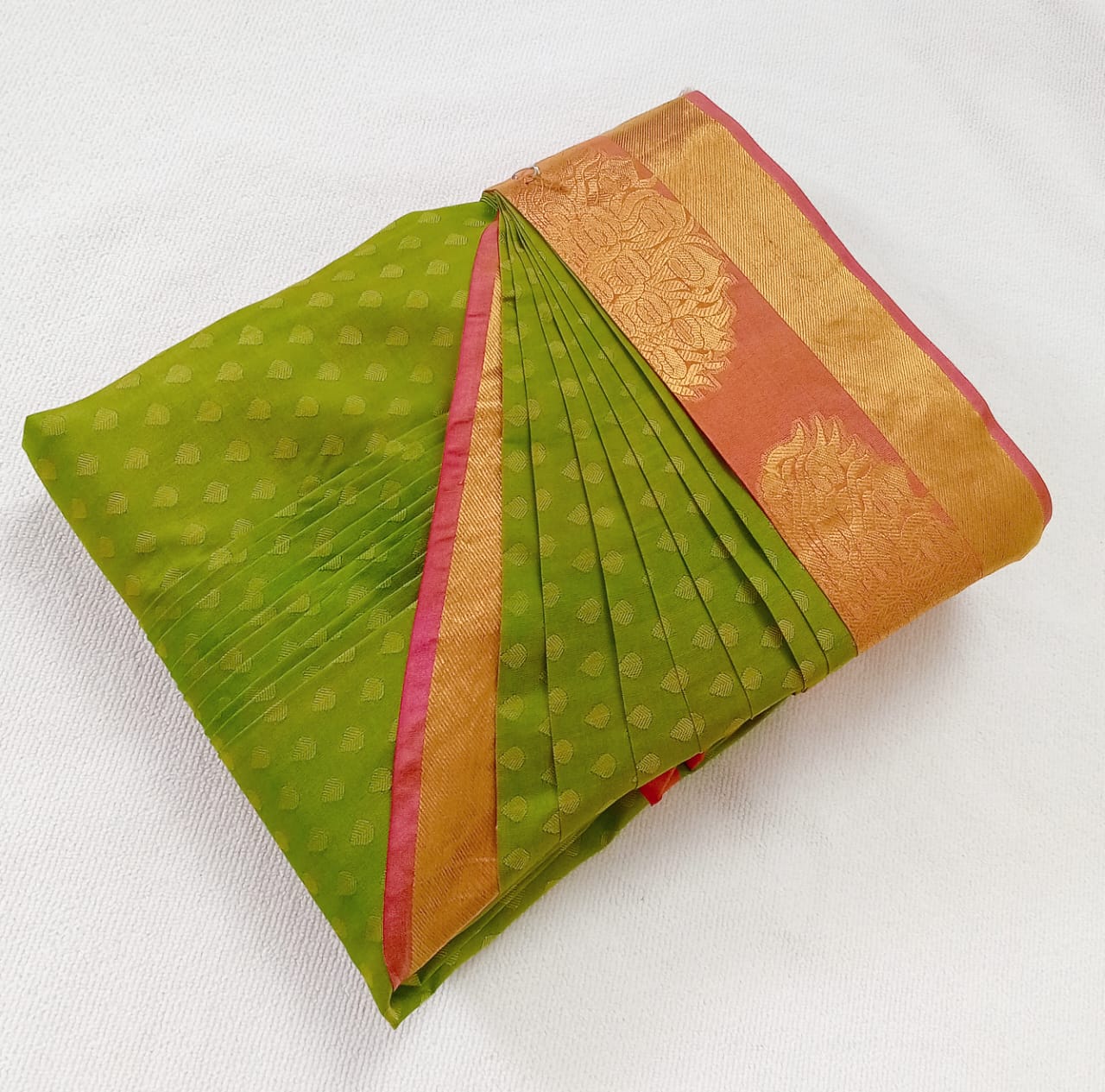 Vibrant cotton saree with geometric patterns.
